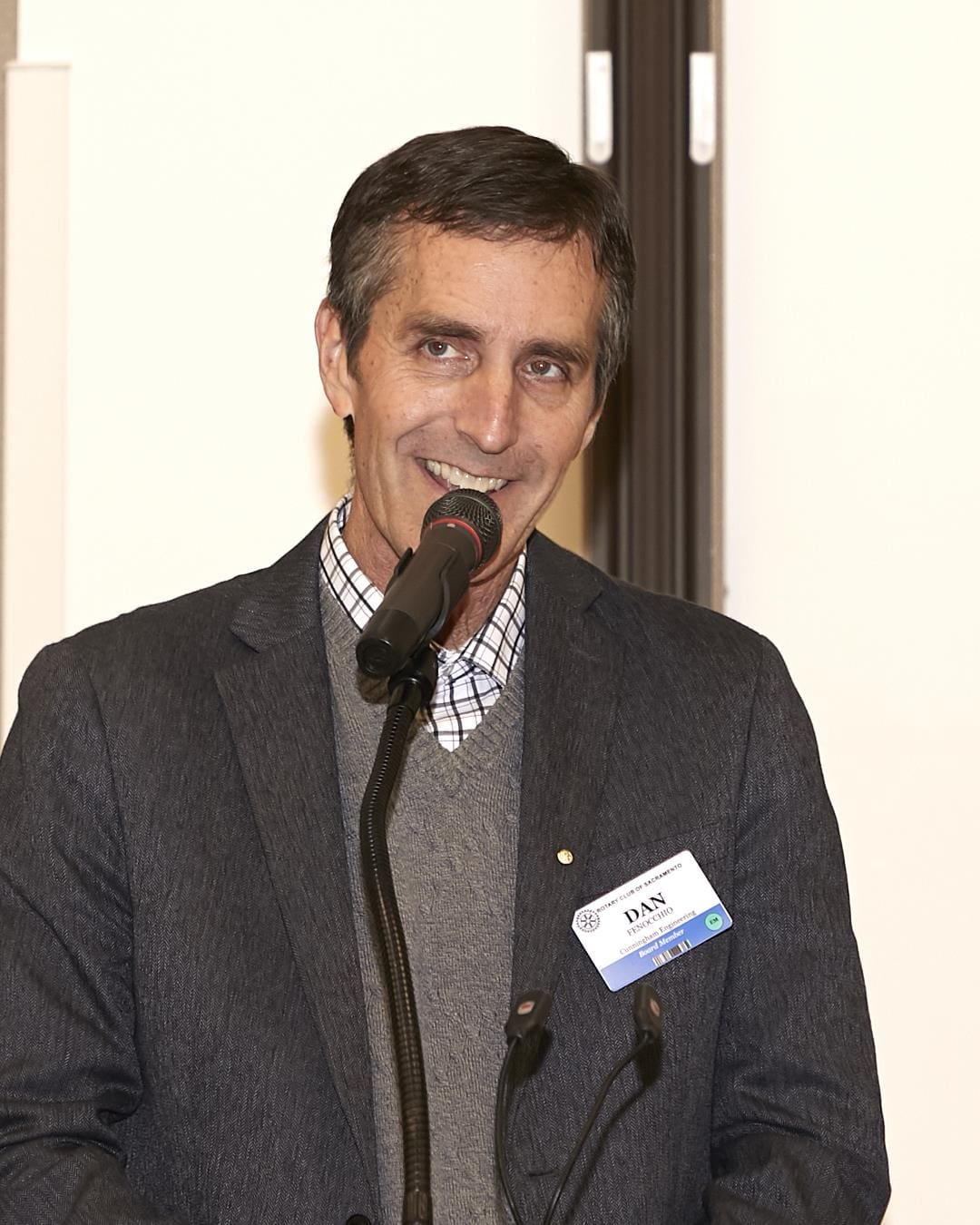 person speaking into a microphone