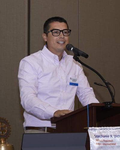 person speaking into a microphone