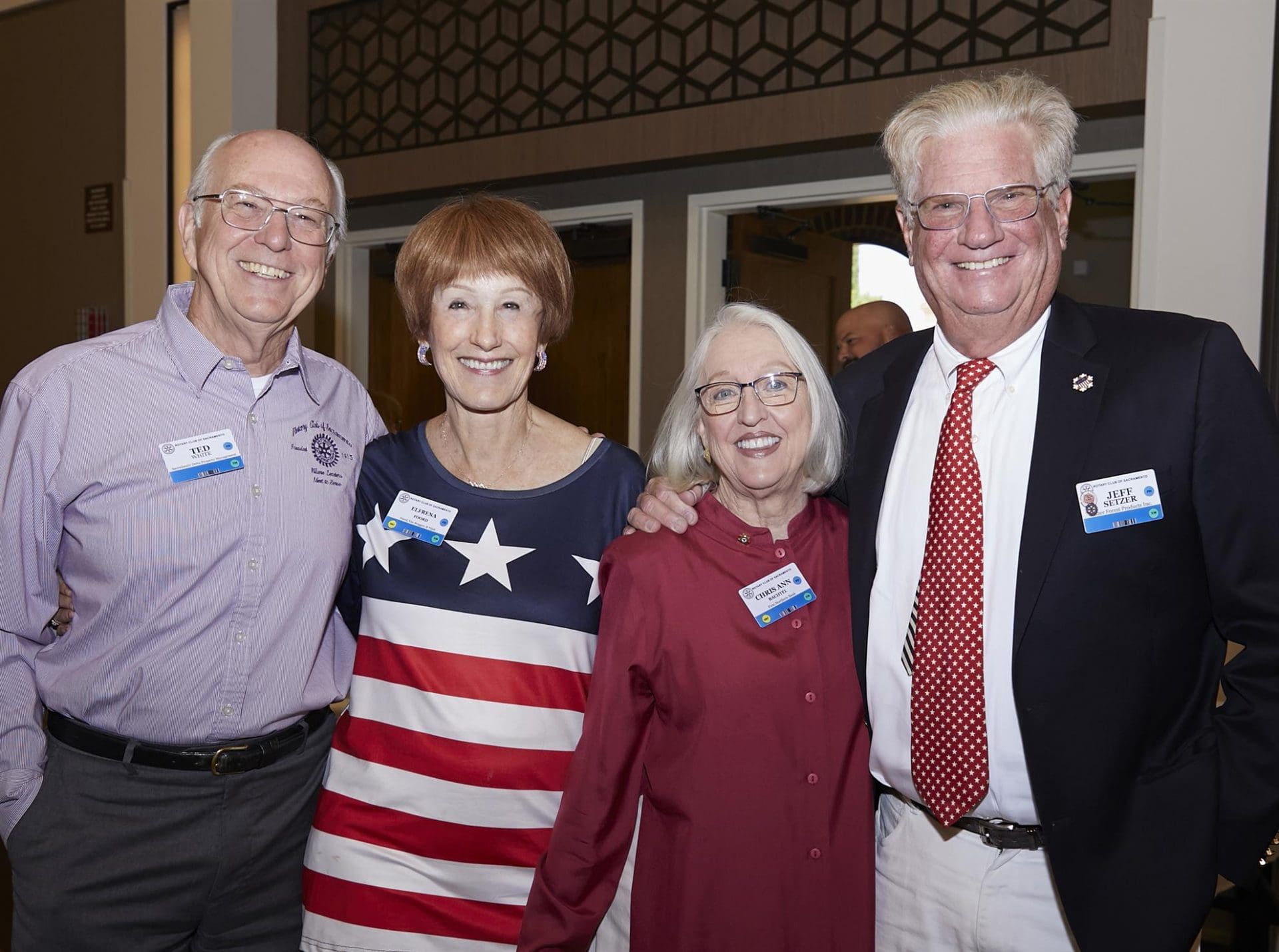 4 people smiling