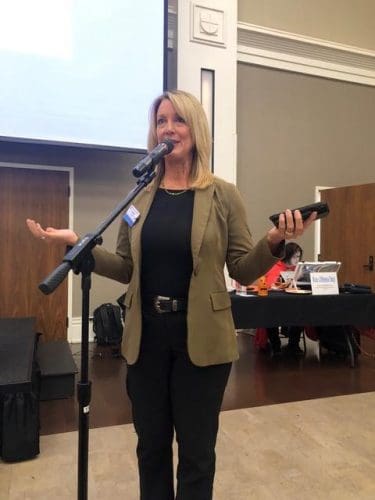 woman speaking into microphone