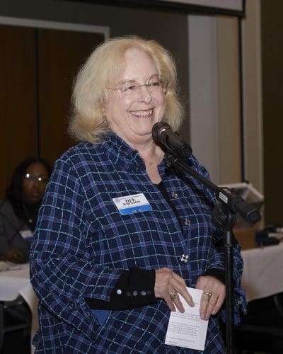 person speaking into microphone