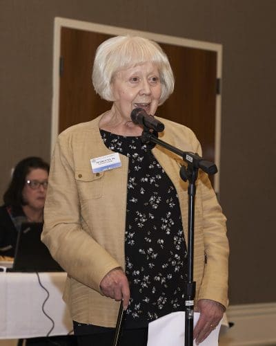 person speaking into microphone
