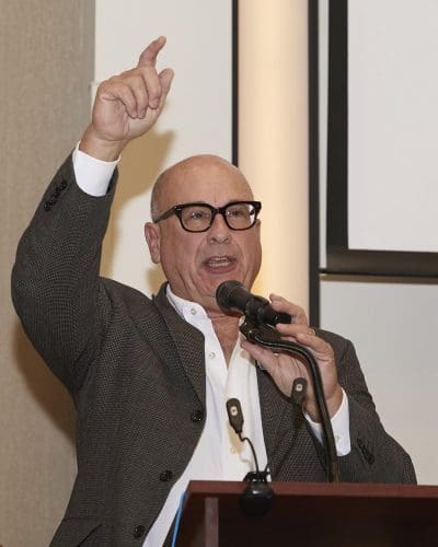 person speaking into microphone 