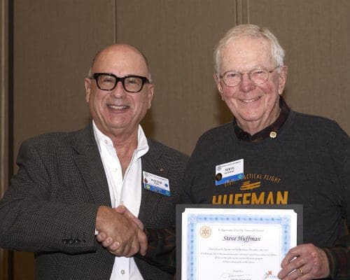 two people holding a certificate