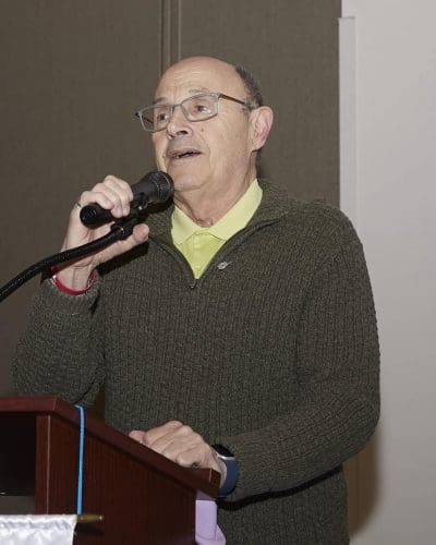 person speaking into microphone