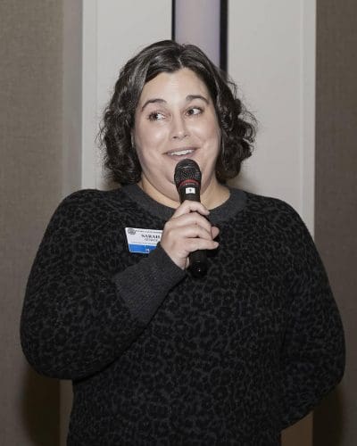 person speaking into microphone