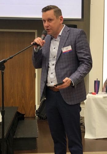person speaking into microphone