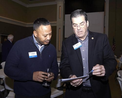 two people looking at clipboard