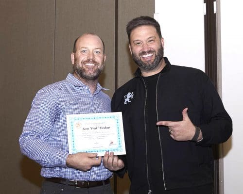 bobby holding certificate