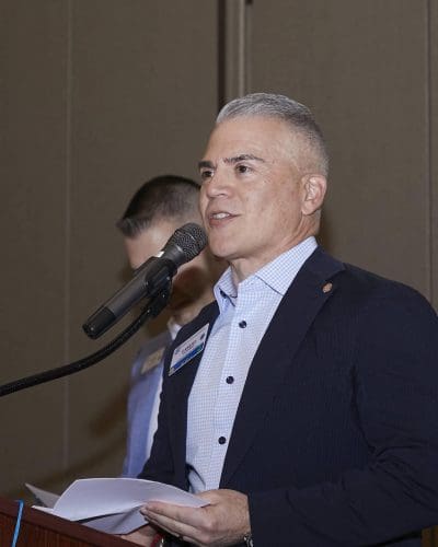 person speaking into microphone