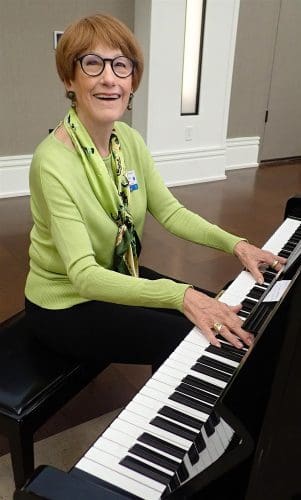 Elfrena Foord playing piano