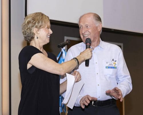 person holding microphone for someone to speak into