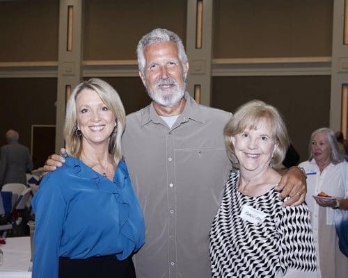 Three rotary members posing for a photograph